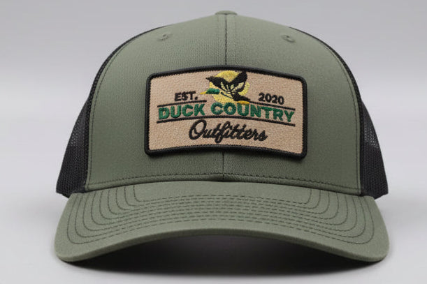 Richardson 112 cap in a classic green color with black mesh. Snap back. 